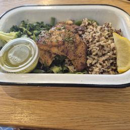Blackened hake, an African fish, with greens and grains. Good and fresh! Garlic/herb sauce on the side was very tasty, but extra. Blackened hake, an African fish, with greens and grains. Good and fresh! Garlic/herb sauce on the side was very tasty, but extra.