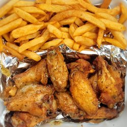 Venson’s Street & Seafood Cafe - Lemon pepper wings (half wet, half dry) with fries. Food truck purchase.