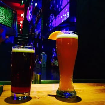 Saloon Bistro Bar - two glasses of beer on a bar counter - Bars Near Me - Montreal, Quebec Saloon Bistro Bar - two glasses of beer on a bar counter - Bars Near Me - Montreal, Quebec