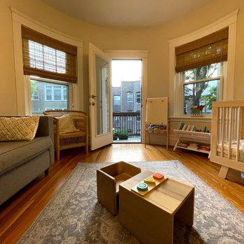 YD construction - a living room with a baby crib - General Contractors Near Me