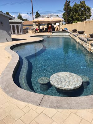 Pool & Spa Build and Remodeling - In a full remodel everything but the shell of the existing pool is removed. Proper depth of trenches are dug to code for the placement of new utility lines such as gas,electrical water supply and drainage. New intake and return lines for the pool must also be upgraded and in most cases a secondary drain be put in. Following the uniform building codes is a must when undertaking a project such as this. These codes have been put into place for the safety of the consumer and to assure reliability of the builder.
A project like this will require a set of plans in order to be able to pull the necessary permits that the city will want. In some situations additional engineering will also be required. Werth Builders can help facilitate with all these requirements as well.
Once the planning,designing and proper permits have been processed the fun is now ready to begin. Its always a good idea to pre-order materials and make sure that they are readily available to the builder so there will be no down time. Try to make all of your material choices ahead of time to insure proper color coordination. There are many styles and colors to pick from that will compliment the final outcome of your project. Again this is something we can help you out with. Water features are now also very much in demand and will add to the beauty and value of your new pool area. Please consult with your designer or us for suggestions on any rock formations, natural rock waterfalls or spillways. This is a project that will give your family and freinds years of pleasure and enjoyment. Pool & Spa Build and Remodeling - In a full remodel everything but the shell of the existing pool is removed. Proper depth of trenches are dug to code for the placement of new utility lines such as gas,electrical water supply and drainage. New intake and return lines for the pool must also be upgraded and in most cases a secondary drain be put in. Following the uniform building codes is a must when undertaking a project such as this. These codes have been put into place for the safety of the consumer and to assure reliability of the builder.
A project like this will require a set of plans in order to be able to pull the necessary permits that the city will want. In some situations additional engineering will also be required. Werth Builders can help facilitate with all these requirements as well.
Once the planning,designing and proper permits have been processed the fun is now ready to begin. Its always a good idea to pre-order materials and make sure that they are readily available to the builder so there will be no down time. Try to make all of your material choices ahead of time to insure proper color coordination. There are many styles and colors to pick from that will compliment the final outcome of your project. Again this is something we can help you out with. Water features are now also very much in demand and will add to the beauty and value of your new pool area. Please consult with your designer or us for suggestions on any rock formations, natural rock waterfalls or spillways. This is a project that will give your family and freinds years of pleasure and enjoyment.