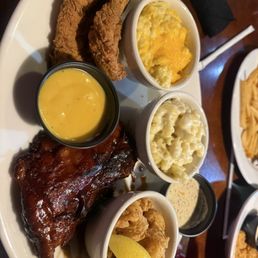 Darryl's Three-Way Sampler Chicken tenders, barbecue ribs, Cajun shrimp with cheddar grits, and mac & cheese Darryl's Three-Way Sampler Chicken tenders, barbecue ribs, Cajun shrimp with cheddar grits, and mac & cheese