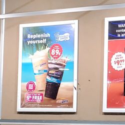ampm - Deals on the side of building.