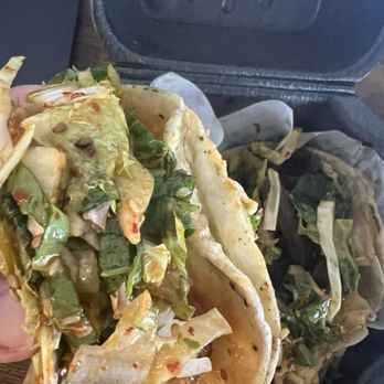 Del Seoul - Left: half eaten shrimp taco; right: kalbi taco - Korean Near Me - Chicago, Illinois