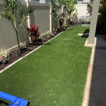 Hapa Landscaping - AFTER: Artificial grass, tropical plants planted, and brick border laid down - Landscaping Near Me - Honolulu, Hawaii Hapa Landscaping - AFTER: Artificial grass, tropical plants planted, and brick border laid down - Landscaping Near Me - Honolulu, Hawaii