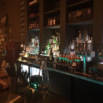 Cru - a dimly lit bar with liquor bottles - Wine Bars Near Me - Davenport, Iowa Cru - a dimly lit bar with liquor bottles - Wine Bars Near Me - Davenport, Iowa