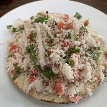 El Manati - Tostada de coco - shredded coconut, onion, parsley and tomato. I'm not a vegetarian but it was a light refreshing lunch! - Breakfast & Brunch Near Me - Bacalar, ROO El Manati - Tostada de coco - shredded coconut, onion, parsley and tomato. I'm not a vegetarian but it was a light refreshing lunch! - Breakfast & Brunch Near Me - Bacalar, ROO