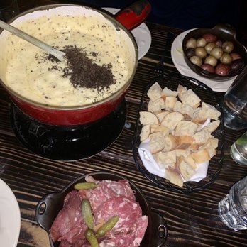 French Alpine Bistro - Cheese Fondue w/ shaved black truffles (MP), charcuterie (+$15), and roasted rosemary potatoes (+$11). - French Near Me - Aspen, Colorado