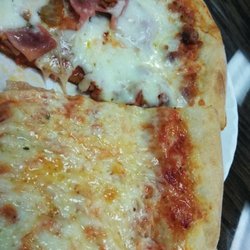 D'Sopranos Pizzeria - Meat lovers on top, regular cheese on the bottom. Both very yummy!!!