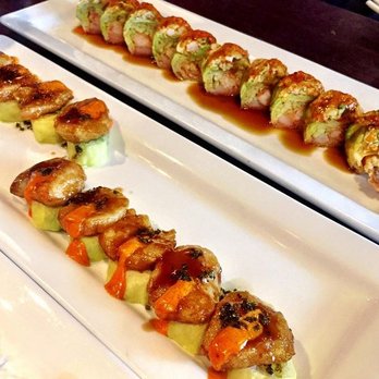 Tanoshii West Loop - In the front is the warm scallop roll - so unique and delicious. I believe the back is the truffle honey roll - yum. - Japanese Near Me - Chicago, Illinois