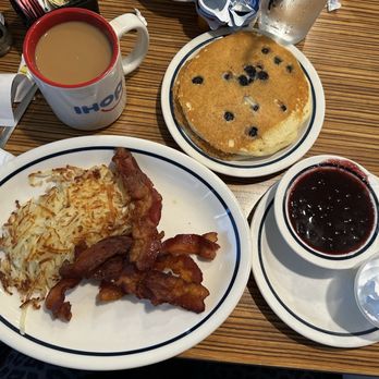 IHOP - Blueberry compote pancakes with crispy bacon & a huge side of hash browns. - Breakfast & Brunch Near Me - Richardson, Texas