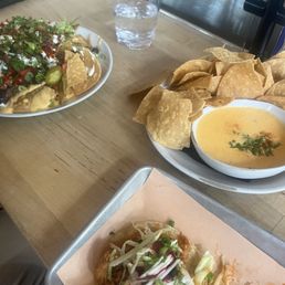 Queso, Nachos and chicken tacos. Delicious!