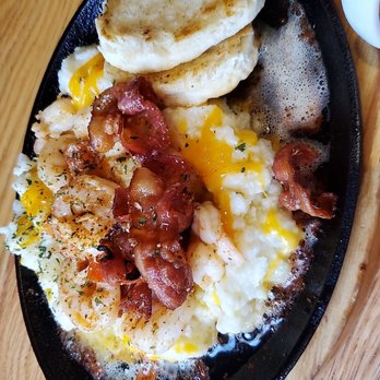 Werner's - Shrimp and Grits..comes with the softest buttery biscuit and bacon strips. - Breakfast & Brunch Near Me - Baltimore, Maryland
