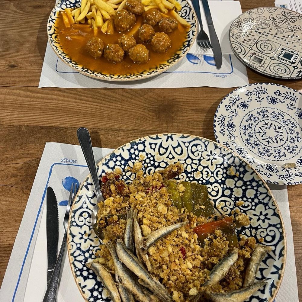 Migas (close up) and Albóndigas (far away). Migas (close up) and Albóndigas (far away).