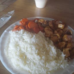 a plate of rice, carrots, and tofu a plate of rice, carrots, and tofu