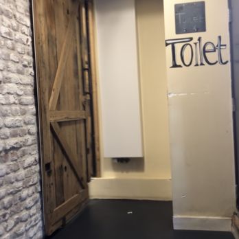 Jacketz Baked Potato - Very cool sliding barn door type for restroom located on lower level. - Restaurants Near Me - Amsterdam, New Hampshire
