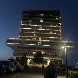 Hôtel Van Der Valk - The front at night.