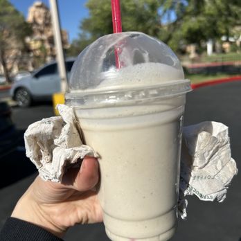 Fatburger & Buffalo's Express - a hand holding a drink - Burgers Near Me - Hesperia, California