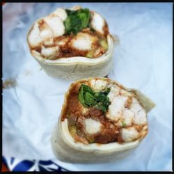 Guido's Fresh Marketplace - Kickin' Chicken wrap: panko chicken breast, pepper jack, lettuce, pickles, banana peppers, and hot sauce in a plain wrap