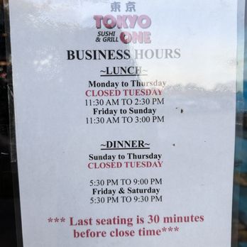 Tokyo One - The sign lists the business hours for Tokyo One Sushi & Grill, including lunch hours from 11:30 AM to 2:30 PM Monday to Thursday and Friday to Sunday until 3:00 PM. Dinner hours are from 5:30 PM to 9:00 PM Sunday to Thursday and Friday to Saturday until 9:30 PM. The sign notes the restaurant is closed every Tuesday and emphasizes that the last seating is 30 minutes before closing time. - Sushi Bars Near Me - Plano, Texas