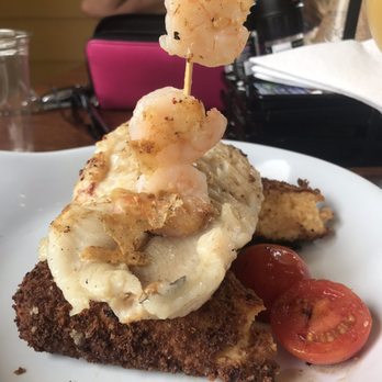 Ruby Slipper Orange Beach - GRILLED FISH 'ST. PETER' - grilled fish of the day over a cheesy grit cake, grilled shrimp & creole mustard hollandaise. - Cafes Near Me - Orange Beach, Alabama