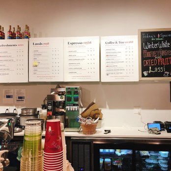Lassi & Spice - a woman behind a counter - Indian Near Me - Seattle, Washington