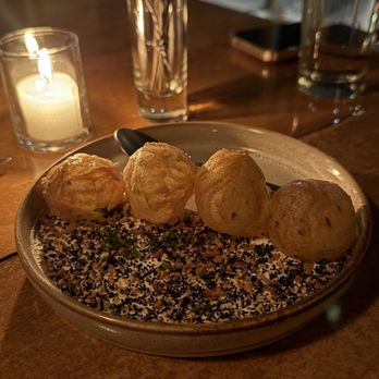 Tuome - Complimentary scallion puffs with house made ricotta and everything spice - New American Near Me - New York, New York