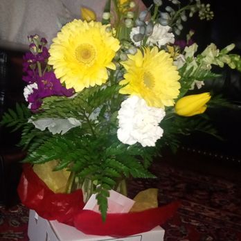 Fruit & Flower Creations - Big yellow gerber daisies, yellow tulips, stock in purple and in white, white carnations, other purple blooms I don't recognize, ferns - Florists Near Me - Portland, Oregon