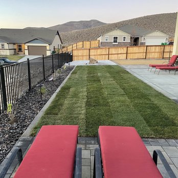 Always Green - Rear yard grass with sprinklers - Masonry/Concrete Near Me