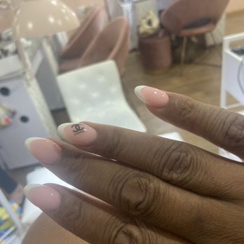 M Studio - French gel nail extensions with Chanel sticker - Nail Salons Near Me - New York, New York M Studio - French gel nail extensions with Chanel sticker - Nail Salons Near Me - New York, New York