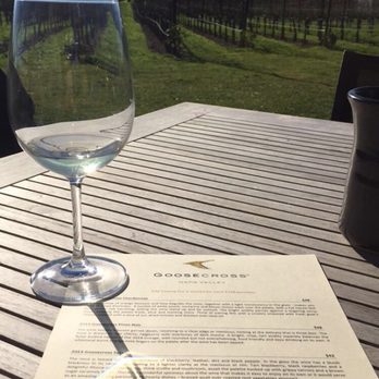 Goosecross Cellars - Seated on the patio with a gorgeous view of the winery and hills! - Wineries Near Me - Yountville, California