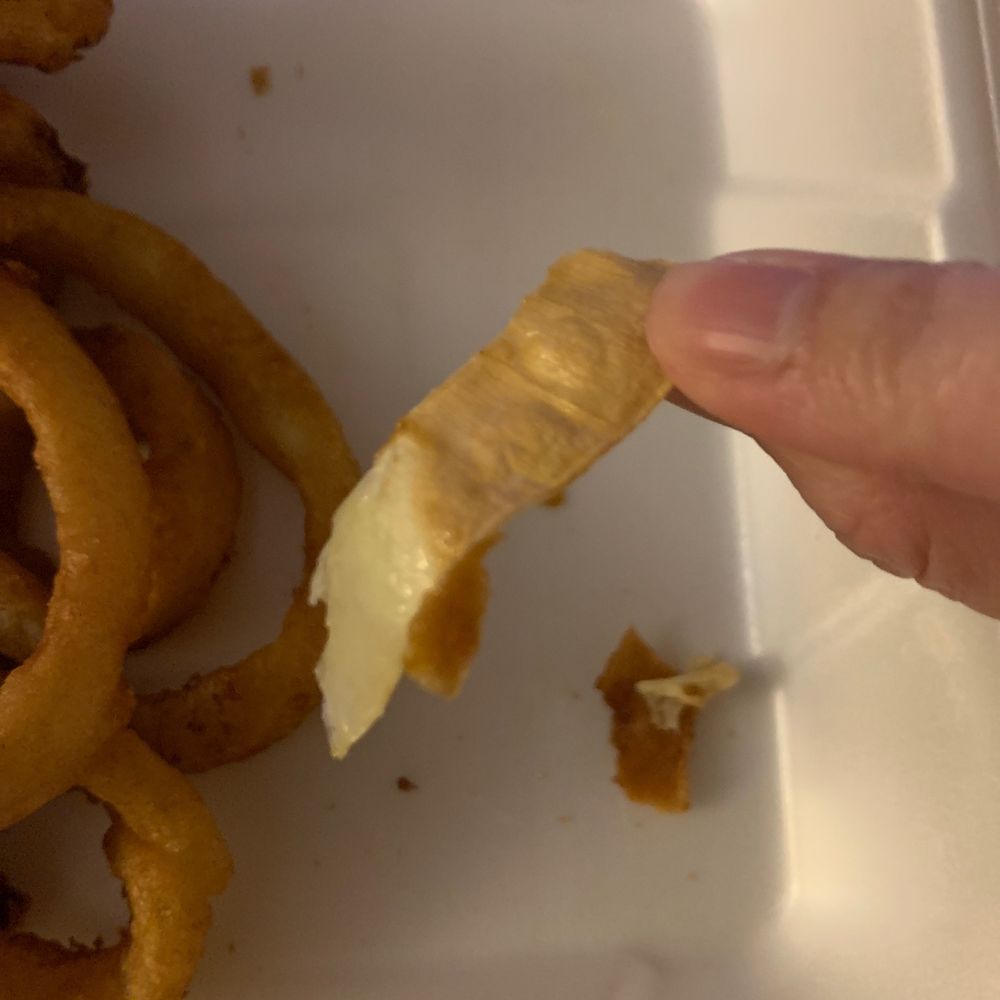 Inside of my onion ring... it's the part of the onion on the outside that you are suppose to PEEL OFF AND DISGARD. Inside of my onion ring... it's the part of the onion on the outside that you are suppose to PEEL OFF AND DISGARD.