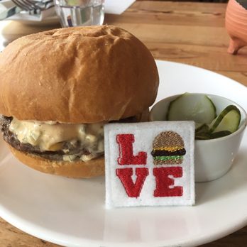 Launderette - Plancha burger ($9) - America cheese, special sauce, pickles, challah. - New American Near Me - Austin, Texas