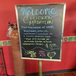 Corona Village - Sign with the food special