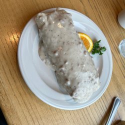 Ron's Comfort Food Cafe - Beautiful breakfast burrito with jalapeño bacon and smothered in gravy yumm