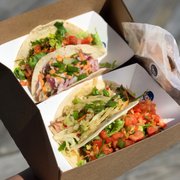 Photo of MOGO Korean Fusion Tacos - Asbury Park, NJ, United States. Left to right: Beef ($4.5), Fish ($5), Chicken ($4), Beef ($4.5)