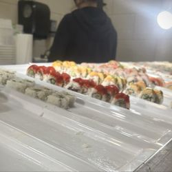 Hibachi Grill and Sushi Buffet - About a dozen fresh made sushi rolls and nigiri on the table.