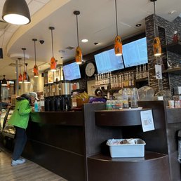 a woman standing at the counter a woman standing at the counter