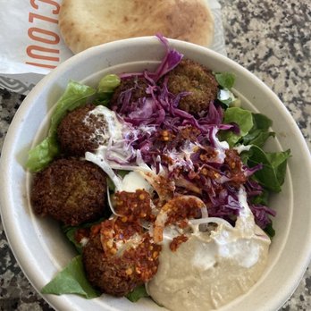 Naf Naf Grill - Falafel, lettuce, hummus, cucumber, pickles, cabbage, garlic sauce, and harissa sauce. A pita is served with it as well. - Middle Eastern Near Me - Carmel, Indiana Naf Naf Grill - Falafel, lettuce, hummus, cucumber, pickles, cabbage, garlic sauce, and harissa sauce. A pita is served with it as well. - Middle Eastern Near Me - Carmel, Indiana