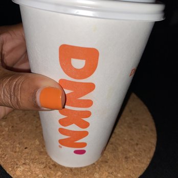 Dunkin' - a hand holding a cup of coffee - Donuts Near Me - Laurel, Maryland Dunkin' - a hand holding a cup of coffee - Donuts Near Me - Laurel, Maryland