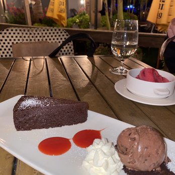 Beach Tavern - Flourless chocolate cake and raspberry sorbet in the background - New American Near Me - Monmouth Beach, New Jersey