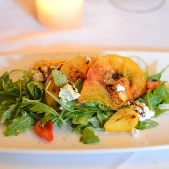Bouchon - Tutti Frutti Farms heirloom tomatoes on dressed arugula with herbed chevre, fresh basil, cherry tomato relish and aged b - French Near Me - Santa Barbara, California