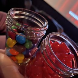 Snacks served in glass jars. Snacks served in glass jars.