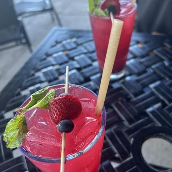 Yards Grille - two cocktails with strawberries and mint - American Near Me - Fayetteville, New York Yards Grille - two cocktails with strawberries and mint - American Near Me - Fayetteville, New York