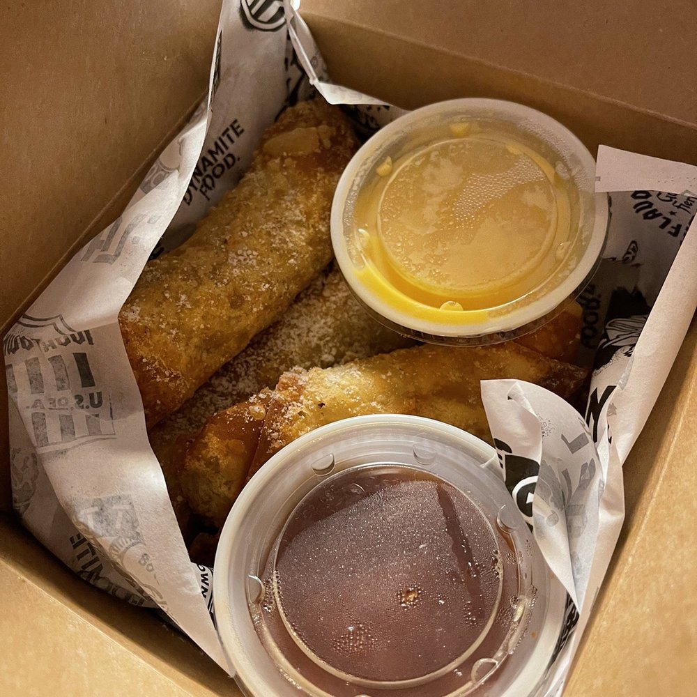 Guy Fieri's Flavortown Kitchen - Steak and cheese spring rolls with nacho cheese and spicy ketchup - Food Delivery Services Near Me Guy Fieri's Flavortown Kitchen - Steak and cheese spring rolls with nacho cheese and spicy ketchup - Food Delivery Services Near Me