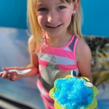 Island Ice Trailer - a young girl holding a cotton candy - Shaved Ice Near Me - Red Bluff, California Island Ice Trailer - a young girl holding a cotton candy - Shaved Ice Near Me - Red Bluff, California