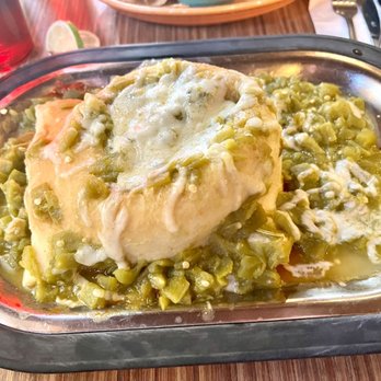 Tomasita's - Carne Adovada stuffed sopaipilla with green chilies on top. - New Mexican Cuisine Near Me - Santa Fe, New Mexico