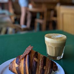 a croissant and a cup of coffee a croissant and a cup of coffee