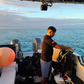 Scuba Life Cozumel - David, my PADI Instructor, securing equipment post dive - Scuba Diving Near Me - Cozumel, ROO Scuba Life Cozumel - David, my PADI Instructor, securing equipment post dive - Scuba Diving Near Me - Cozumel, ROO