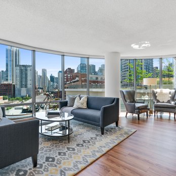 Kingsbury Plaza - Relax and unwind in your large living room! Give us a call at  (312) 728-7923 to schedule a tour today! - Apartments Near Me - Chicago, Illinois